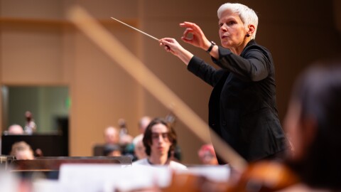 Nell Flanders, Civic Symphony Conductor, conducts during a dress rehearsal for original music by Pedro Giraudo, an Argentine composer on Thursday, February 15, 2024.