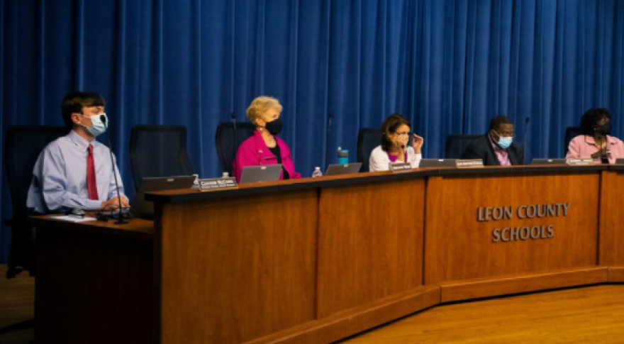 Members of the Leon County School Board preside over a meeting from a long dais. (Craig Moore/WFSU Public Media)