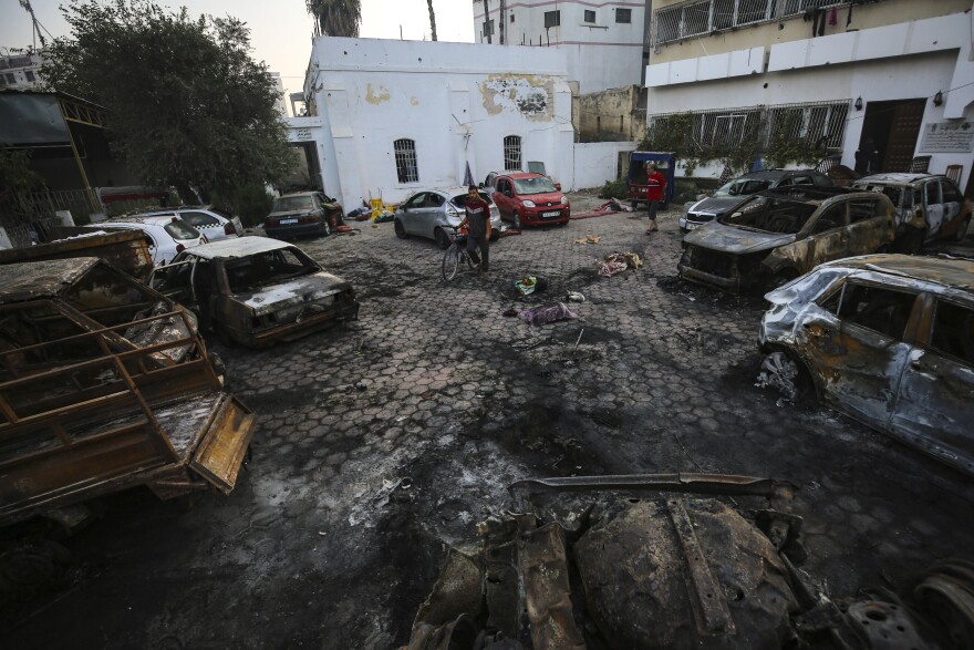 Wed., Oct. 18: Palestinians check the place of the explosion at al-Ahli hospital, in Gaza City.