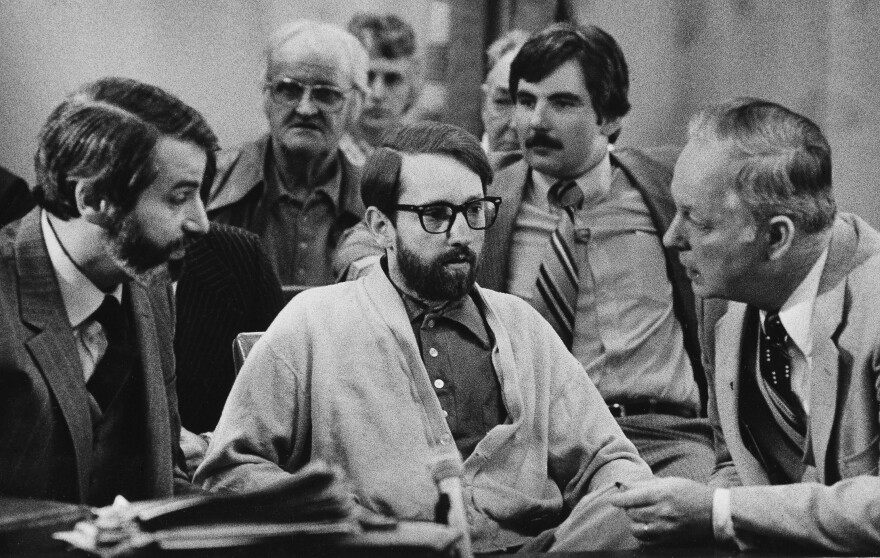 Mass murderer James Ruppert, center, listens to his attorneys, H.J. Bressler, left, and Hugh Holbrook, right, as they prepare to ask for a change of venue retrial on March 18, 1980 in Butler County Common Pleas Court in Hamilton, Ohio