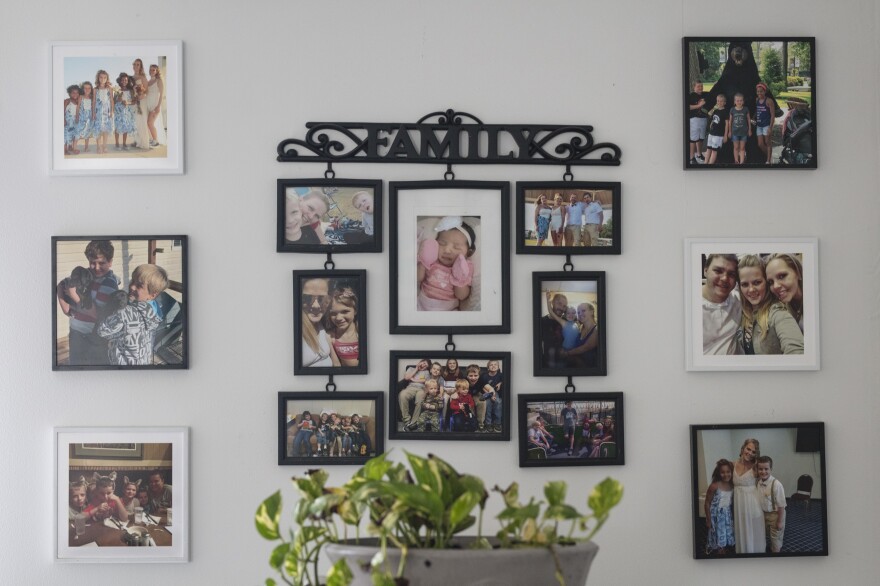 The walls of the Johnsons' home are filled with family photos.