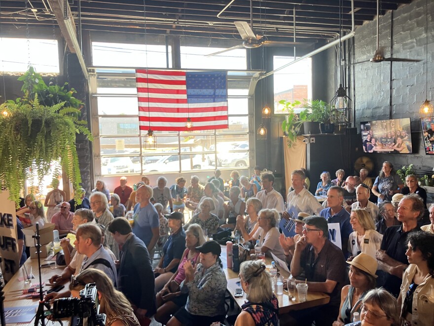 Members of the audience listen during Democratic Senate nominee Roy Cooper's event at Oklawaha Brewing Co. in Hendersonville Thursday, Aug. 20, 2026.