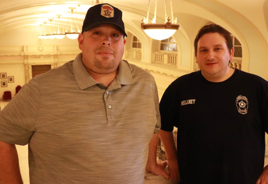 Jason Page and Paul Mullaney inside the state Capitol on Tuesday.