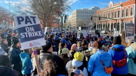 A crowd of people with signs