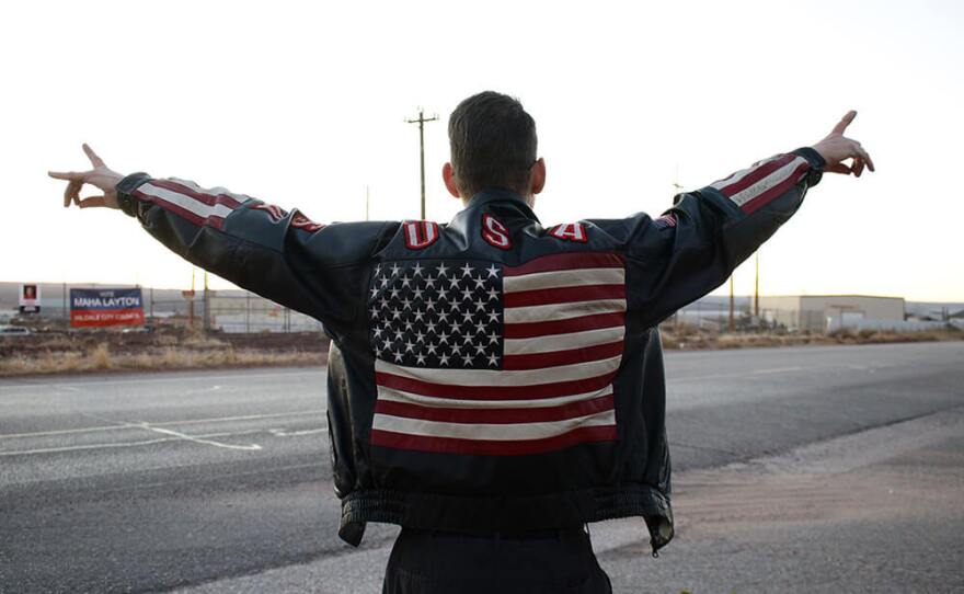 City Council candidate Jared Nicol shows off his signature jacket while campaigning just hours before the polls closed on Election Day.