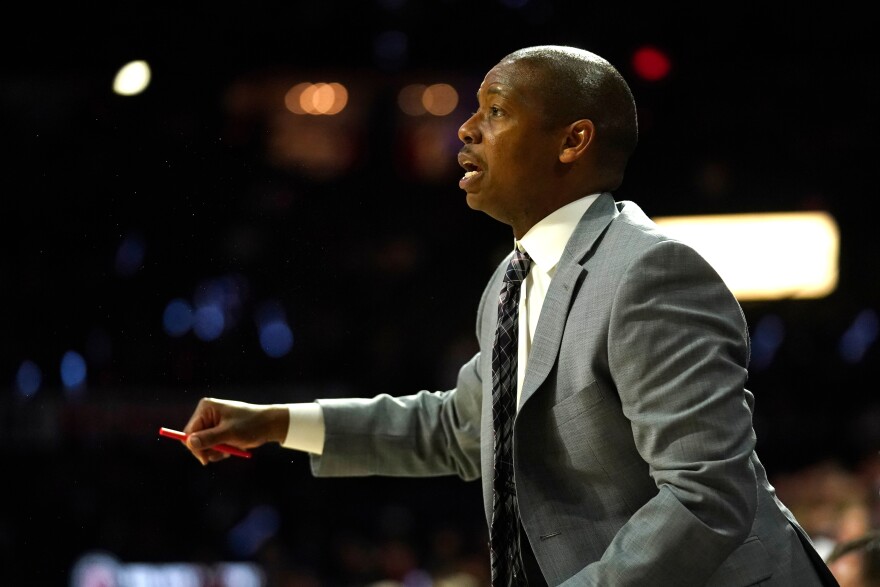 FILE - Arizona assistant coach Justin Gainey gestures during the second half of an NCAA college basketball game against Washington State on March 5, 2020, in Tucson, Ariz.
