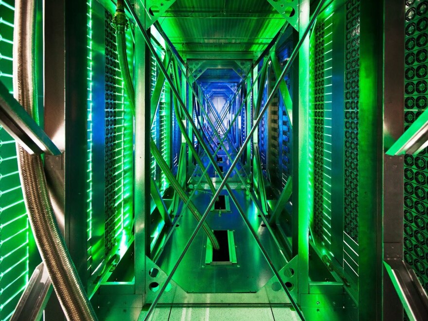 A rare look behind the server aisle in Mayes County, Okla. Hundreds of fans funnel hot air from the server racks into a cooling unit to be recirculated. This is the first time Google has opened the doors of its data centers to outsiders.