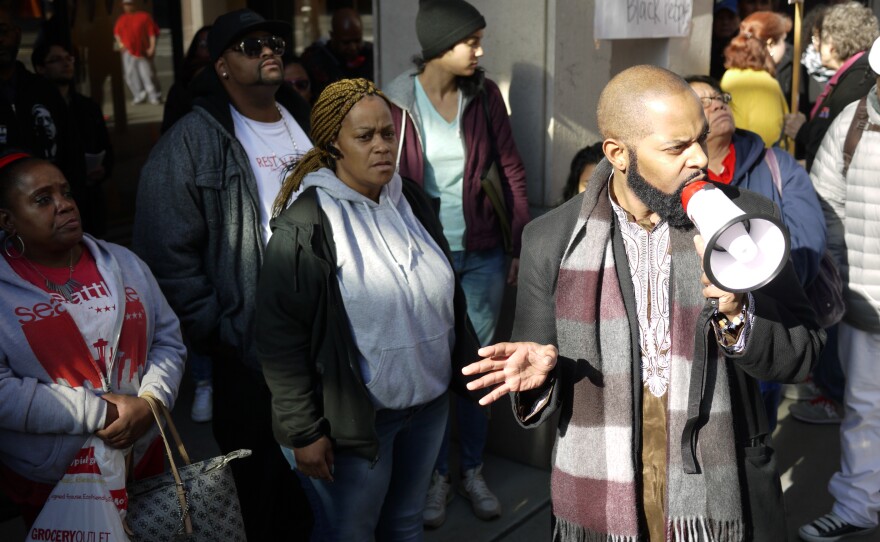 Andre Taylor, brother of Che Taylor, who was killed by Seattle Police on Feb. 21, 2016 addresses a crowd of protesters on Thursday, Feb. 25, 2016.