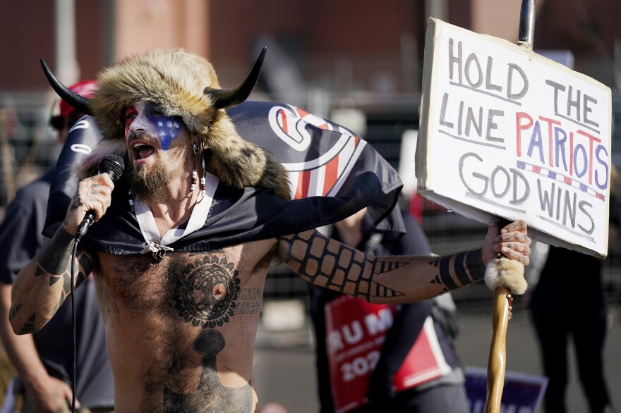 PHOENIX: Jake Angeli, a supporter of President Donald Trump, speaks at a rally outside the Maricopa County Recorder's Office Saturday, Nov. 7, 2020, in Phoenix.