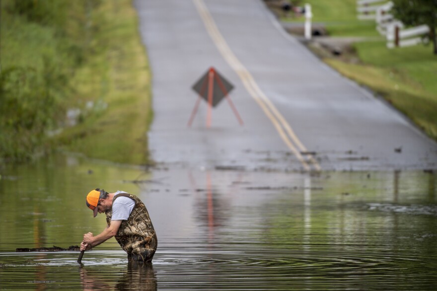 Dickson Public Works personnel check the flooding on Old Pond Lane following heavy rainfall on Saturday in Dickson, Tenn.