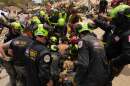 U.S. firefighters from Fairfax County search and rescue team pull a boy from the rubble after rescuing him and his father from a building that collapsed in the earthquakes in La Guaira, Venezuela, Sunday, June 28, 2026.