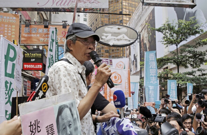 Freed Hong Kong bookseller Lam Wing-kee speaks in front of his Hong Kong bookstore on June 18. He spent months in detention on the mainland for publishing banned books critical of China's Communist leadership.