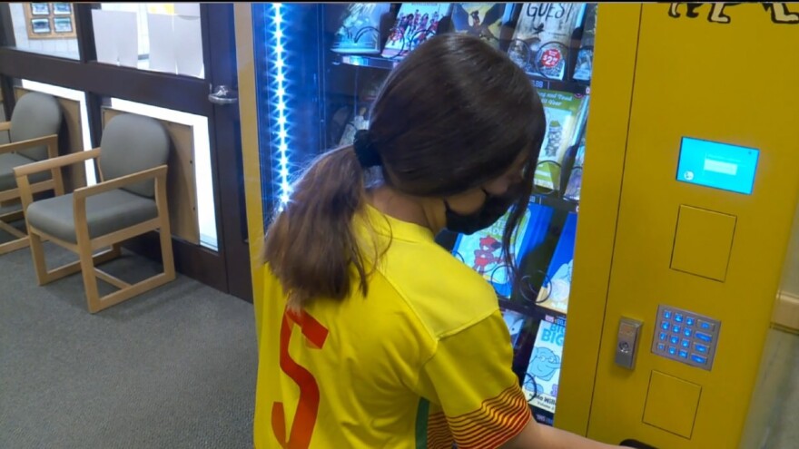 A student using Lakeview Elementary School's book vending machine.