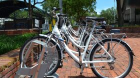 A row of rental bikes stand idle at Bo Diddley Community Plaza. Go Gainesville, the city's bike share program, saw an average of two rentals a day in May. Officials said rental numbers are expected to grow after the summer months. (Lauren Johnson / WUFT.org)