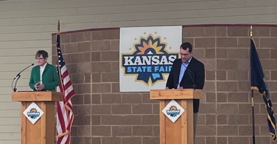 Gov. Laura Kelly and Attorney General Derek Schmidt met in a gubernatorial debate Saturday at the Kansas State Fair.