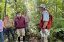 Gary Anderson speaks to a crowd touring his property Sept. 12 near Outing. 