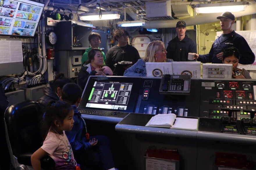 people touring a Coast Guard cutter