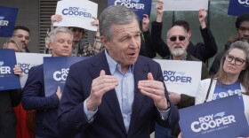 Democratic former Gov. Roy Cooper, who is running for U.S. Senate, speaks to reporters after casting his ballot on the first day of in-person early voting in the state's primary election, Thursday, Feb. 12, 2026, in Raleigh, N.C.