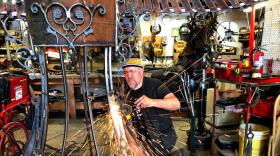 Jud Turner welds together pieces of Veribus.