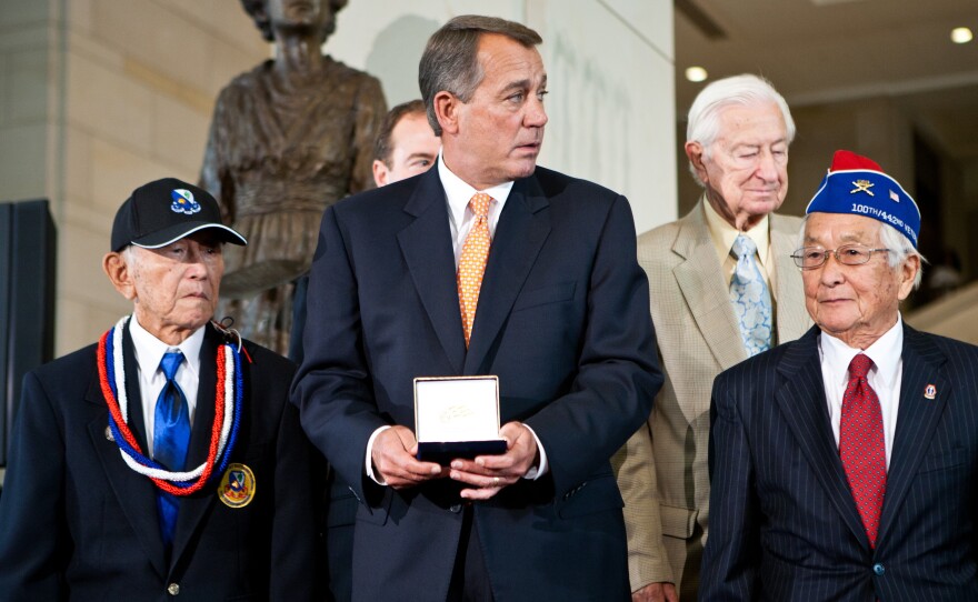 Former Speaker of the House Rep. John Boehner presents the Congressional Gold Medal to Susumu Ito of the 442nd Regimental Combat Team, an Army unit comprised of Japanese Americans from Hawaii which became the most decorated unit for its size and service.