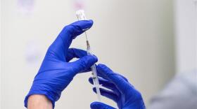 Health care workers at the University of Rochester Medical Center in Rochester, NY receive their first dose of the Pfizer-BioNTech COVID-19 vaccine on Dec. 14, 2020.