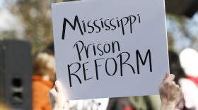 Several attendees waved handmade posters calling for help for the inmates during a mass rally in front of the Mississippi Capitol in Jackson, Miss., Friday, Jan. 24, 2020, protesting conditions in prisons where inmates have been killed in violent clashes in recent weeks. (Rogelio V. Solis/AP)