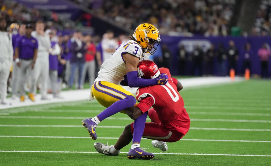 LSU cornerback DJ Pickett (3) stops Houston wide receiver Amare Thomas (0) during the second half of the Kinder's Texas Bowl, Saturday, Dec. 27, 2025, in Houston. Pickett wore a No. 3 jersey as a freshman last year but was wearing No. 5 when August camp opened last week.