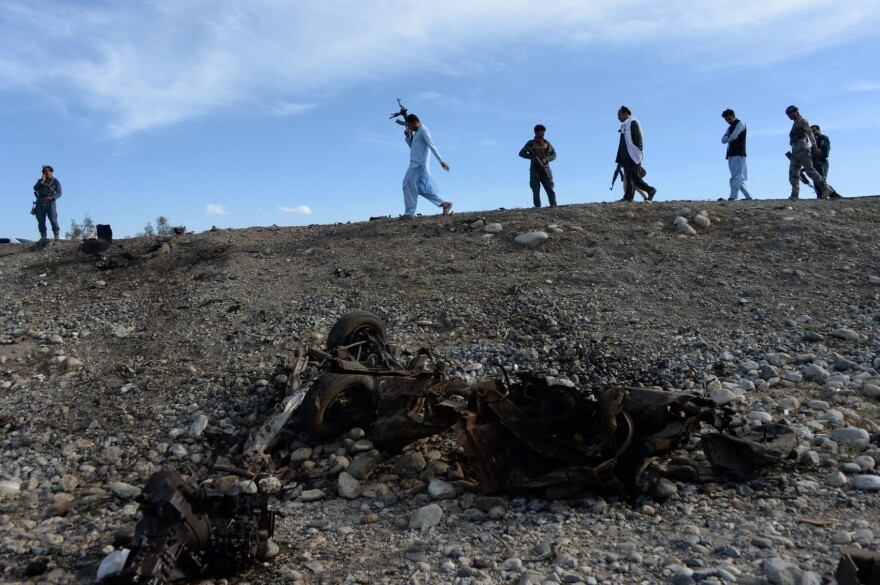 Afghan security forces inspect the site of a suicide attack targeting foreign troops in the Bati Kot district of Nangarhar province on May 1, 2017. (Noorullah Shirzada/AFP/Getty Images)