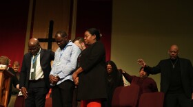 Faith leaders and Haitian community leaders pray at St. John Missionary Baptist Church in Springfield, Ohio, Monday, during an event in support of Haitian migrants fearing the end of their Temporary Protected Status.