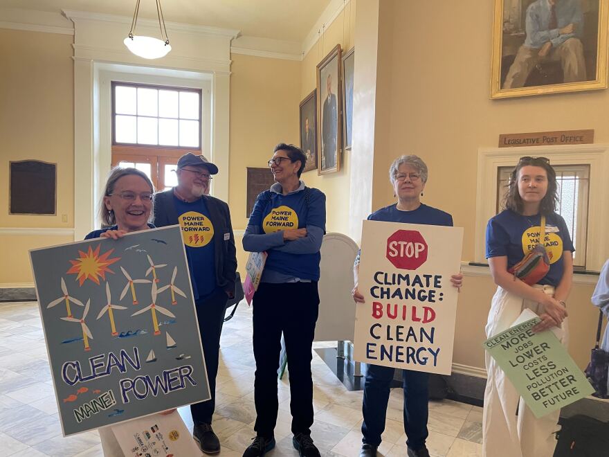 Clean energy advocates gathered at the Maine State House in Augusta holding signs Thursday to urge lawmakers to pass several bills.