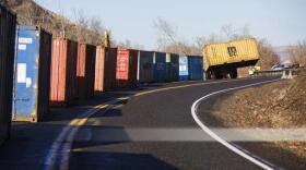 Crews arrange large containers along Thorpe Road near Rattlesnake Ridge south of Union Gap, Wash., Wednesday, Jan. 3, 2018. The containers will be filled with concrete barriers in an effort to keep rocks and other debris from falling onto Interstate 82. (Shawn Gust/Yakima Herald-Republic/via AP)Crews arrange large containers along Thorpe Road near Rattlesnake Ridge south of Union Gap, Wash., Wednesday, Jan. 3, 2018. The containers will be filled with concrete barriers in an effort to keep rocks and other debris from falling onto Interstate 82. (Shawn Gust/Yakima Herald-Republic/via AP)