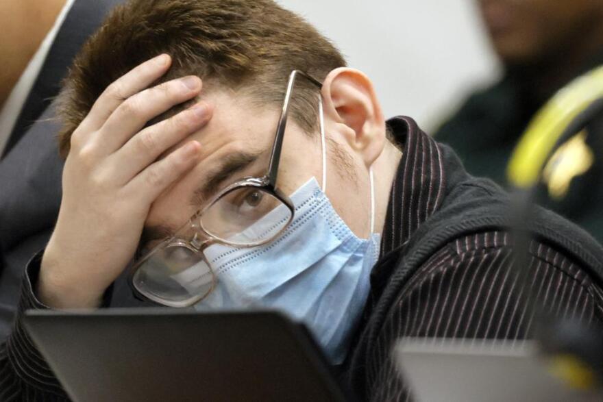  FILE - Marjory Stoneman Douglas High School shooter Nikolas Cruz listens to testimony while seated at the defense table during the penalty phase of his trial at the Broward County Courthouse, Friday, July 22, 2022, in Fort Lauderdale, Fla. Cruz previously plead guilty to all 17 counts of premeditated murder and 17 counts of attempted murder in the 2018 shootings. 