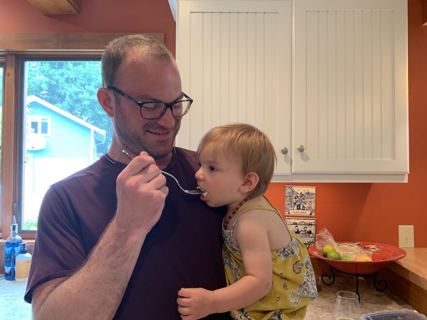 Freddy Hunt's daughter snacks on cheesy grits.