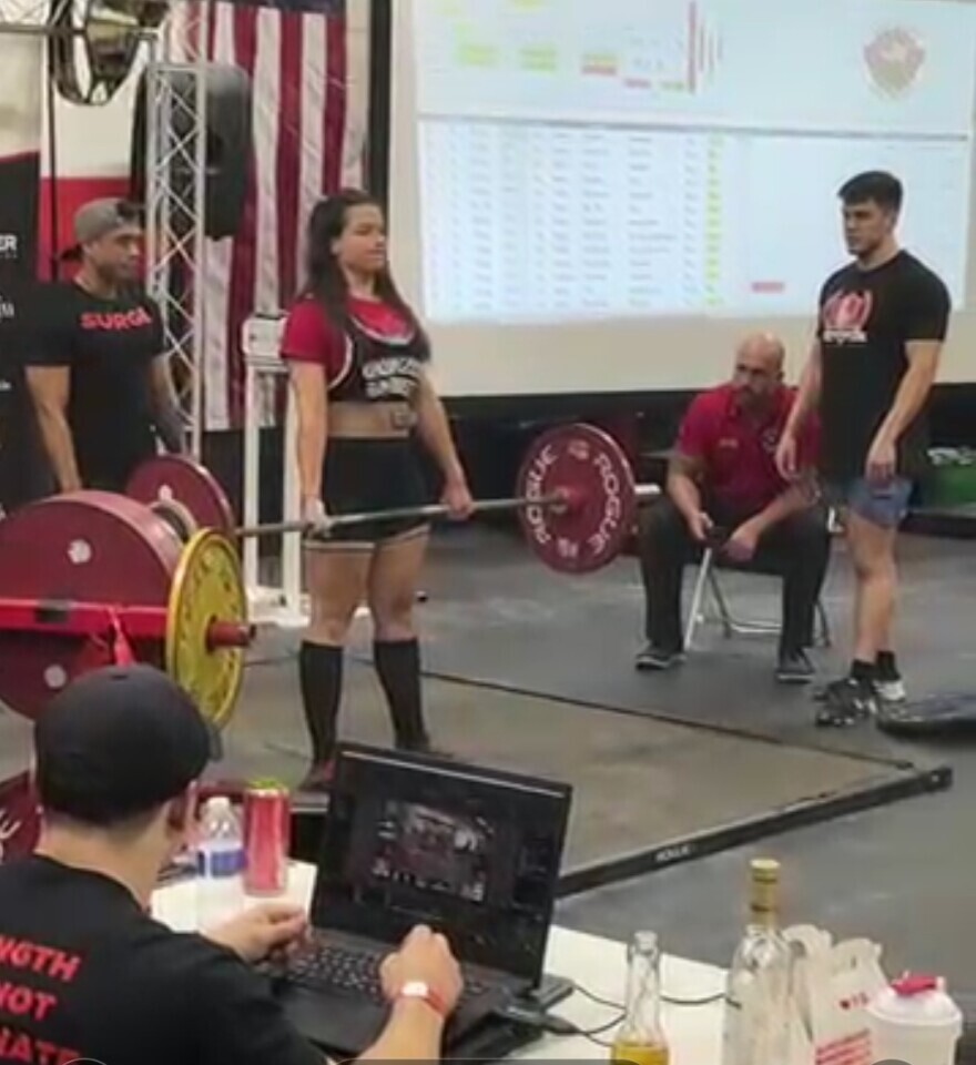 ISU student Grace Berger lifts weights to break state records.