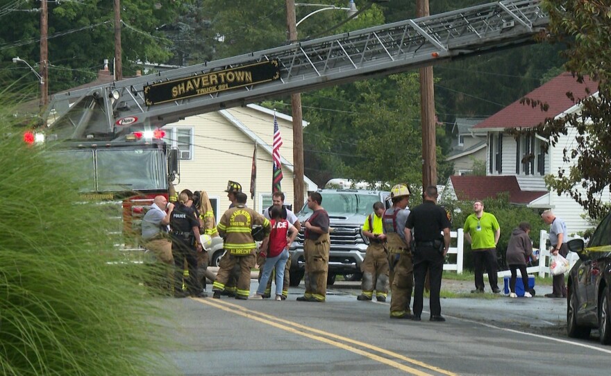 Emergency personnel are seen outside a home that burned in Shavertown, Kingston Twp., Luzerne County on Wednesday morning, Aug. 5, 2026. One man died and two other people were hospitalized following the blaze.