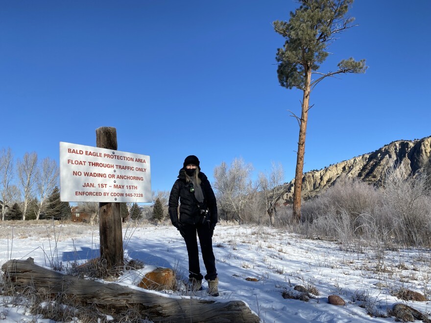 Sibel Tekce stands next to a sign designating a protected area for bald eagles near her home in Aspen Glen during the Christmas Bird Count on Dec. 18, 2021. Tekce joined other concerned residents and wildlife specialists earlier this year to stop the designation from being lifted for residential development.