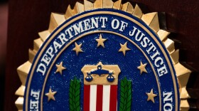 An FBI seal is displayed on a podium before a news conference at the field office in Portland, Ore., Thursday, Jan. 16, 2025.