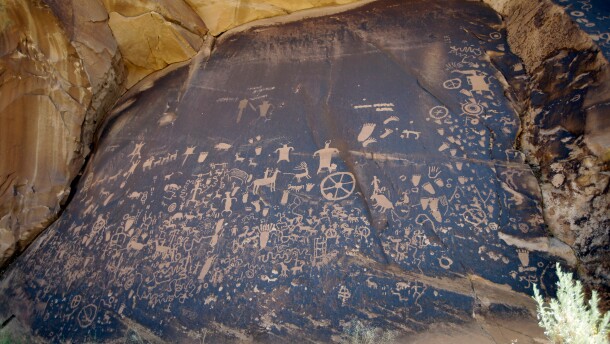 FILE - Newspaper Rock, featuring a rock panel of petroglyphs in the Indian Creek Area, is seen near Monticello, Utah, on July 14, 2016. (AP Photo/Rick Bowmer, File)