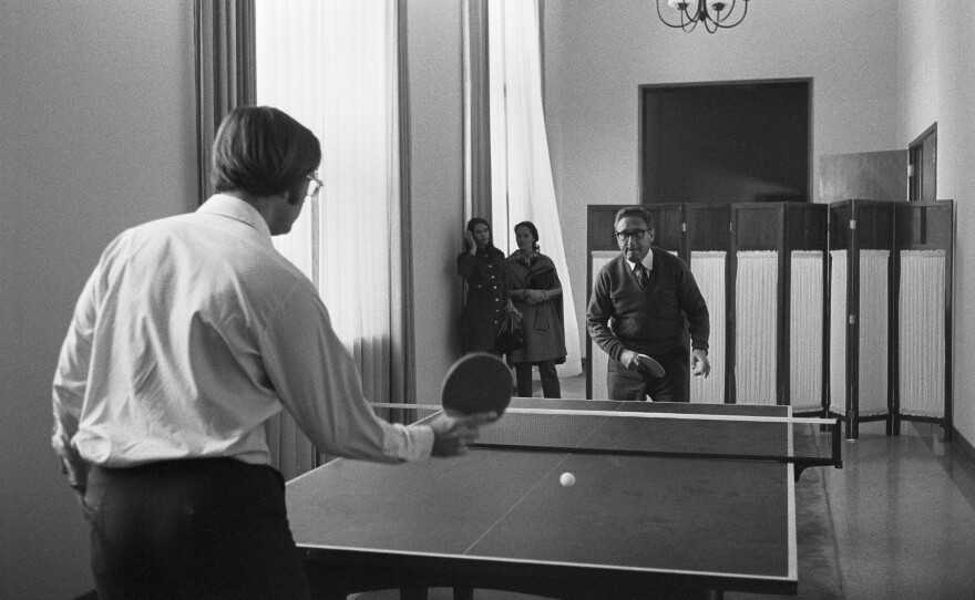 National Security Adviser Henry Kissinger (right) plays pingpong with aide Winston Lord during an advance trip to the People's Republic of China in 1971.