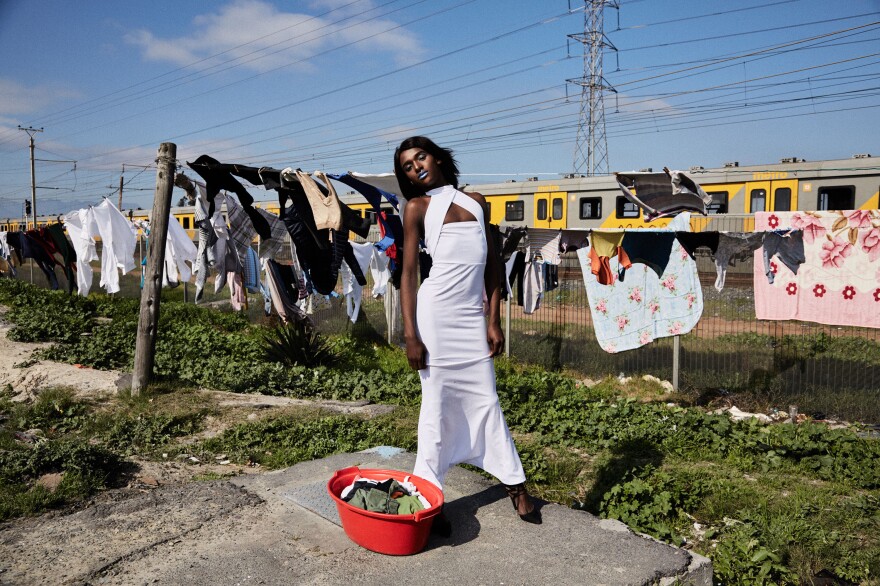 Liyana Arianna Madikizela, 17, is a drag artist from the township of Kayamandi. She poses near a string of drying clothes to challenge traditional gender roles. "I realized I was different when I didn't want to do the stereotypical manly duties," she says. "I was always keen to do house duties such as washing dishes, doing the laundry, cleaning the house and cooking."