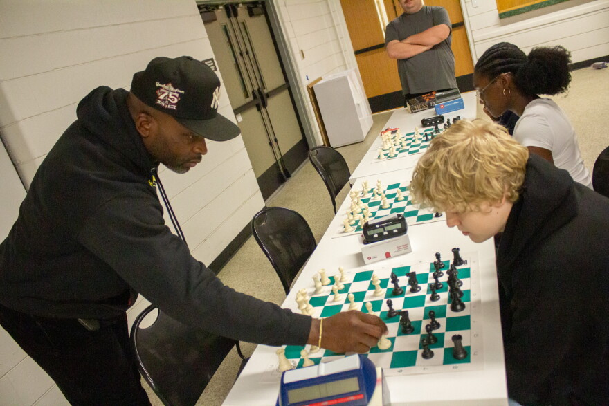 Masters and Mentors founder Tony Ballard points out a chess move to Gavin Hannah during a class at the Carl G. Brewer Community Center.