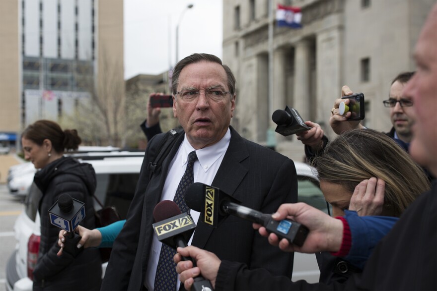 Attorney Ed Dowd walks out of a St. Louis courthouse Thursday. A judge ruled that Greitens' felony invasion of privacy trial would continue.
