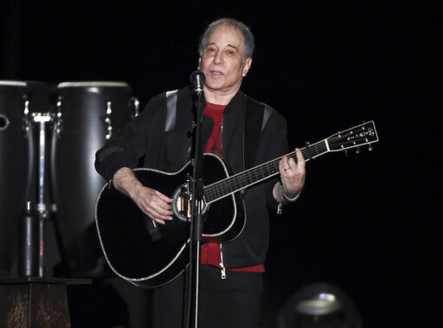 FILE - This Sept. 22, 2018 file photo shows singer-songwriter Paul Simon performing in Flushing Meadows Corona Park. (Photo by Evan Agostini/Invision/AP, File)