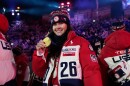 U.S. freestyle skier Kayla Kuhn poses with her gold medal at the closing ceremony of the 2026 Winter Olympics, in Verona, Italy, Sunday, Feb. 22, 2026.
