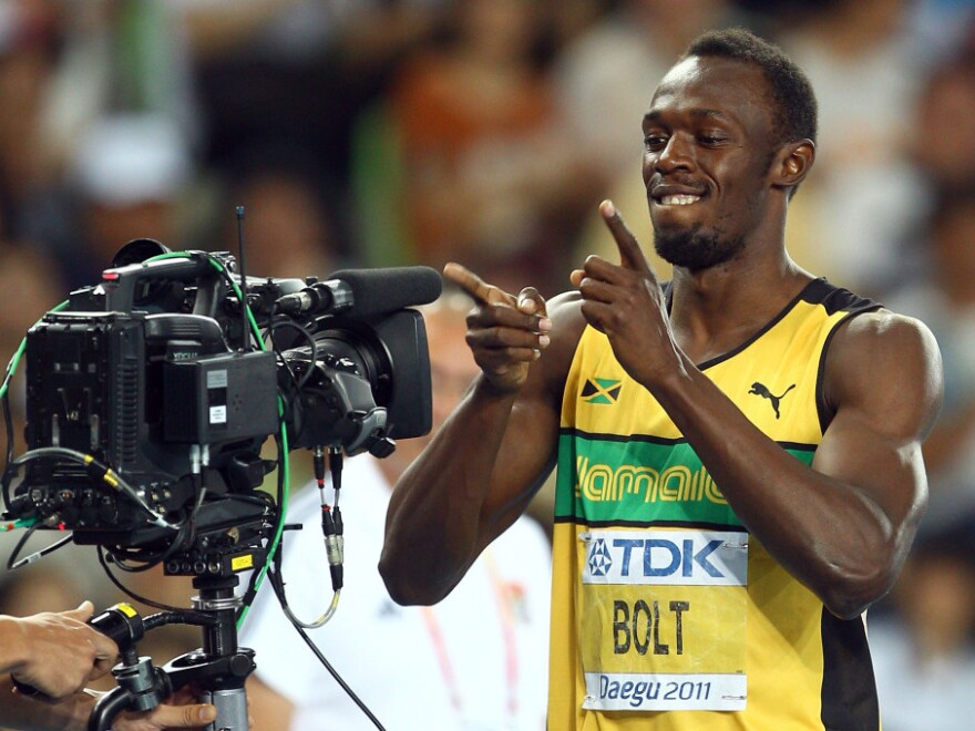 Many track fans watched online four years ago, as sprinter Usain Bolt set a world record at the Beijing Olympics. This year, NBC will stream video of all 302 events online. And Bolt, seen here showing his appreciation for video in 2010, will try to repeat his feat.