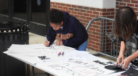 Students with People for Black History making posters for the rally