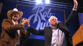 Democratic Congressional candidate Rob Quist (left) and Sen. Bernie Sanders (I-VT) greet supporters during a campaign rally on May 20, 2017, in Butte, Montana. (Justin Sullivan/Getty Images)
