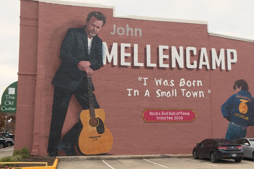 Mural artist Pamela Bliss says Mellencamp glorified Seymour as America’s “small town” in his iconic 1985 single.