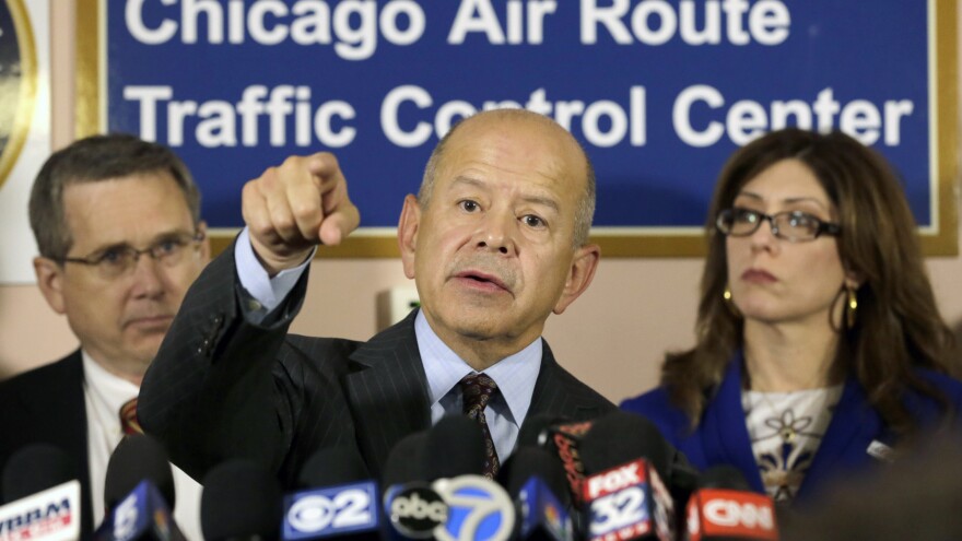 Federal Aviation Administration Administrator Michael Huerta answers questions Friday after touring the Chicago air traffic control center with Sen. Mark Kirk, R-Ill. (left), and city aviation Commissioner Rosemarie Andolino.