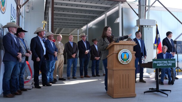 Texas Gov. Greg Abbott, right, listens as U.S. Secretary of Agriculture Brooke Rollins speaks during a ribbon-cutting ceremony for the grand opening of a Domestic New World Screwworm Sterile Fly Production Facility to combat the northward spread of NWS and protect American livestock, in Edinburg, Texas, Monday, Feb. 9, 2026.